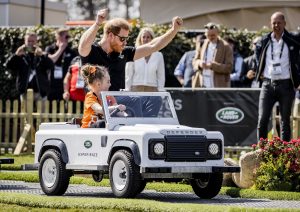 Prince Harry Rides Shotgun in Comically Small Vehicle, Faces Obstacles